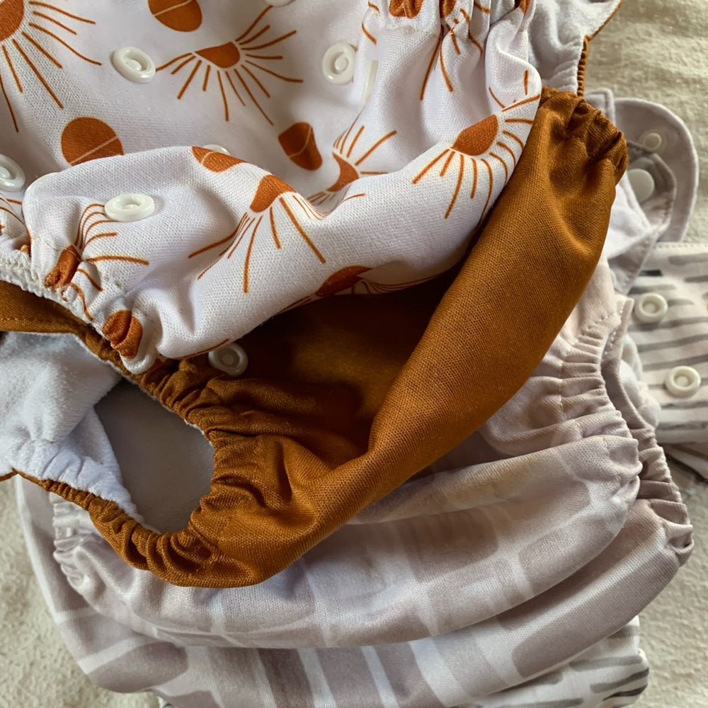Reusable diaper stash Bum genius and Charlie banana